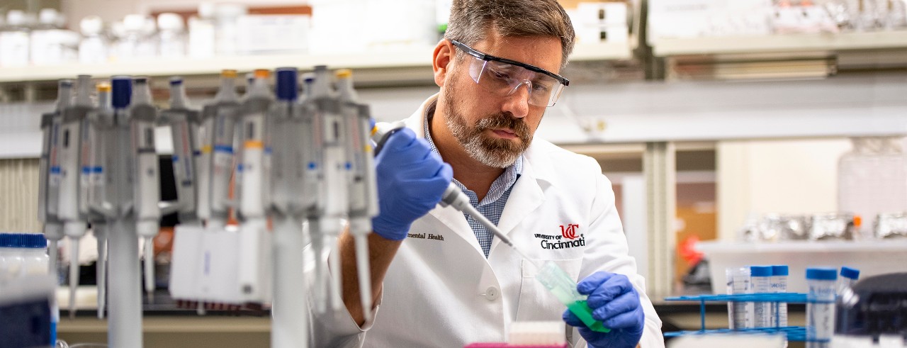 Scott Langevin researches mouthwash samples to detect cancer
