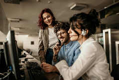 THree people looking at the same computer screen